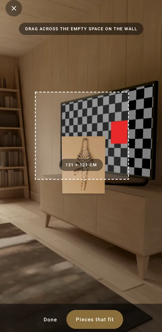 Measuring a space: a dashed rectangle on the wall reading 131 by 121 centimetres, with Pieces that fit